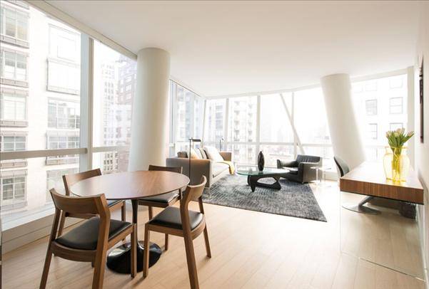 Striking Midtown East 3 Bedroom Apartment with 3 Baths featuring a Fitness Center and Pool