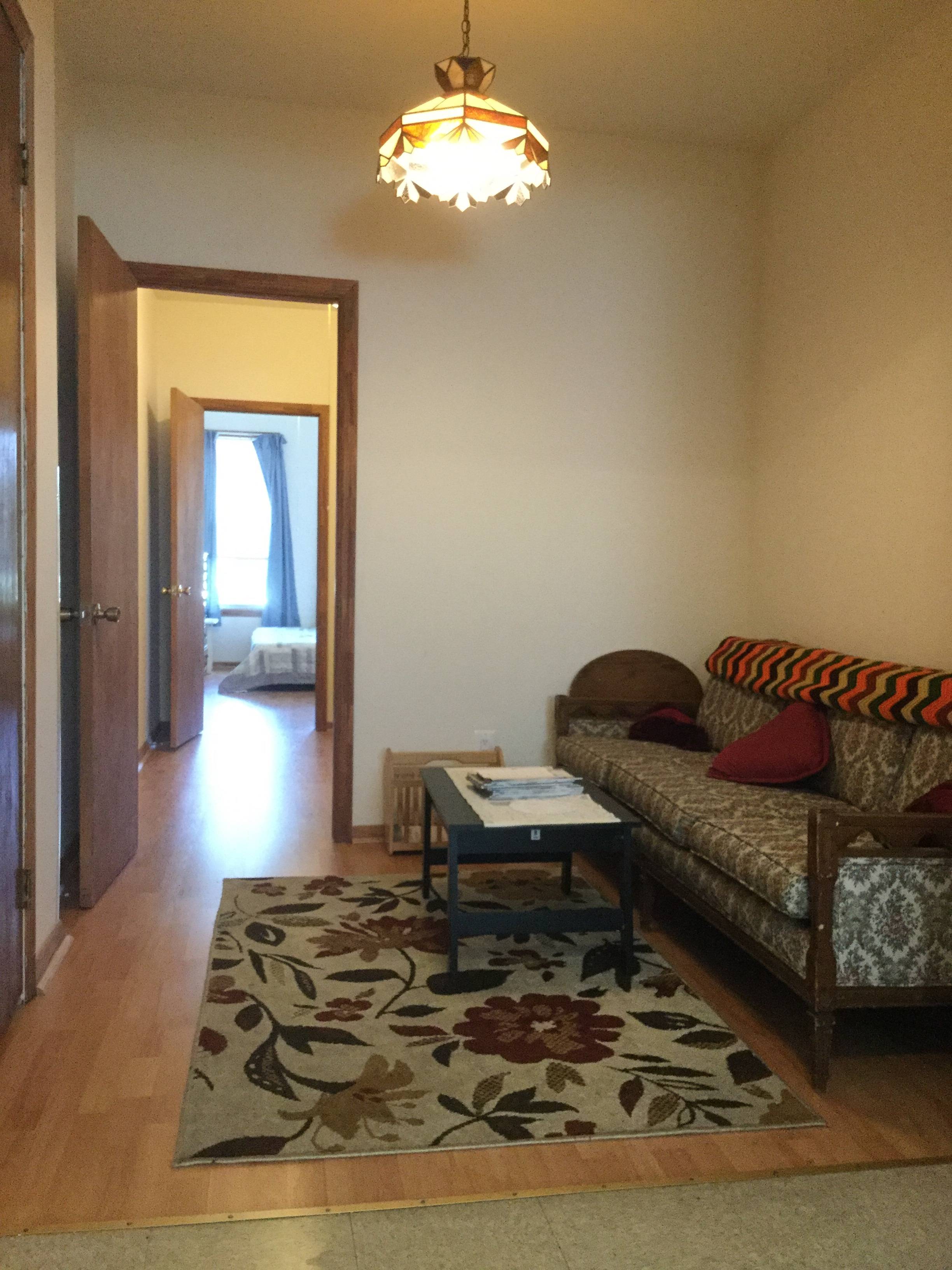 Furnished railroad style sunny 2 bedroom in Maspeth, Queens.