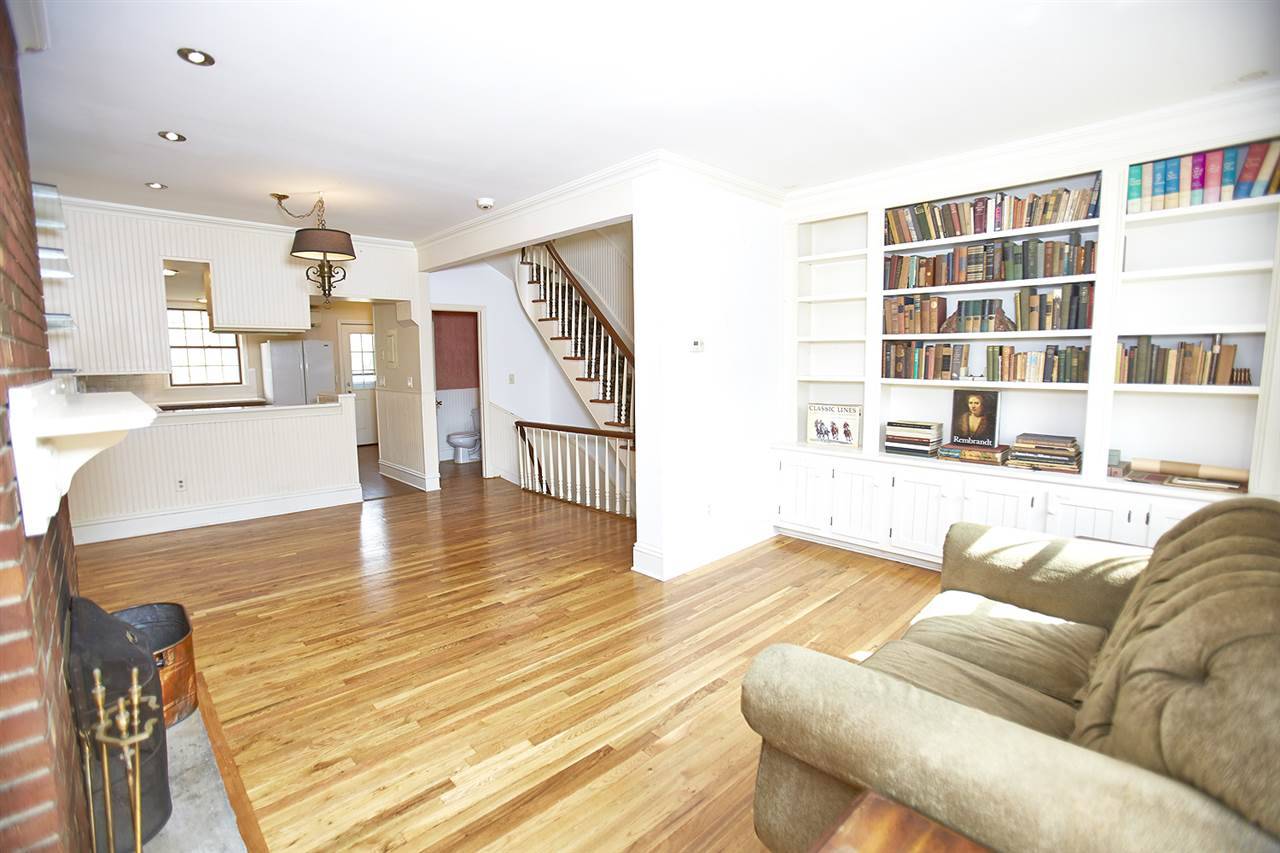 Beautiful brick Victorian townhouse with Mansard roof on one of the most picturesque streets in Downtown Jersey City