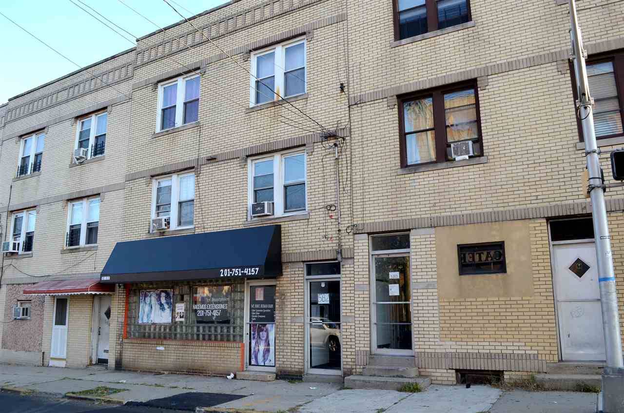 This three unit Mixed-Use brick property is situated on 24 x 50 lot with a total of three stories