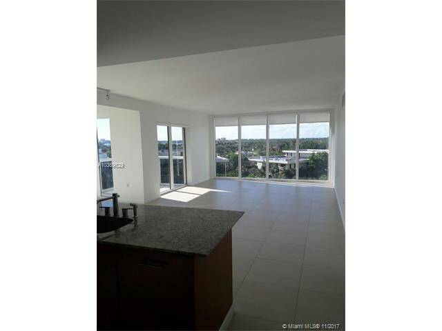 This bright corner unit apartment has floor to ceiling windows throughout and gorgeous views from every room