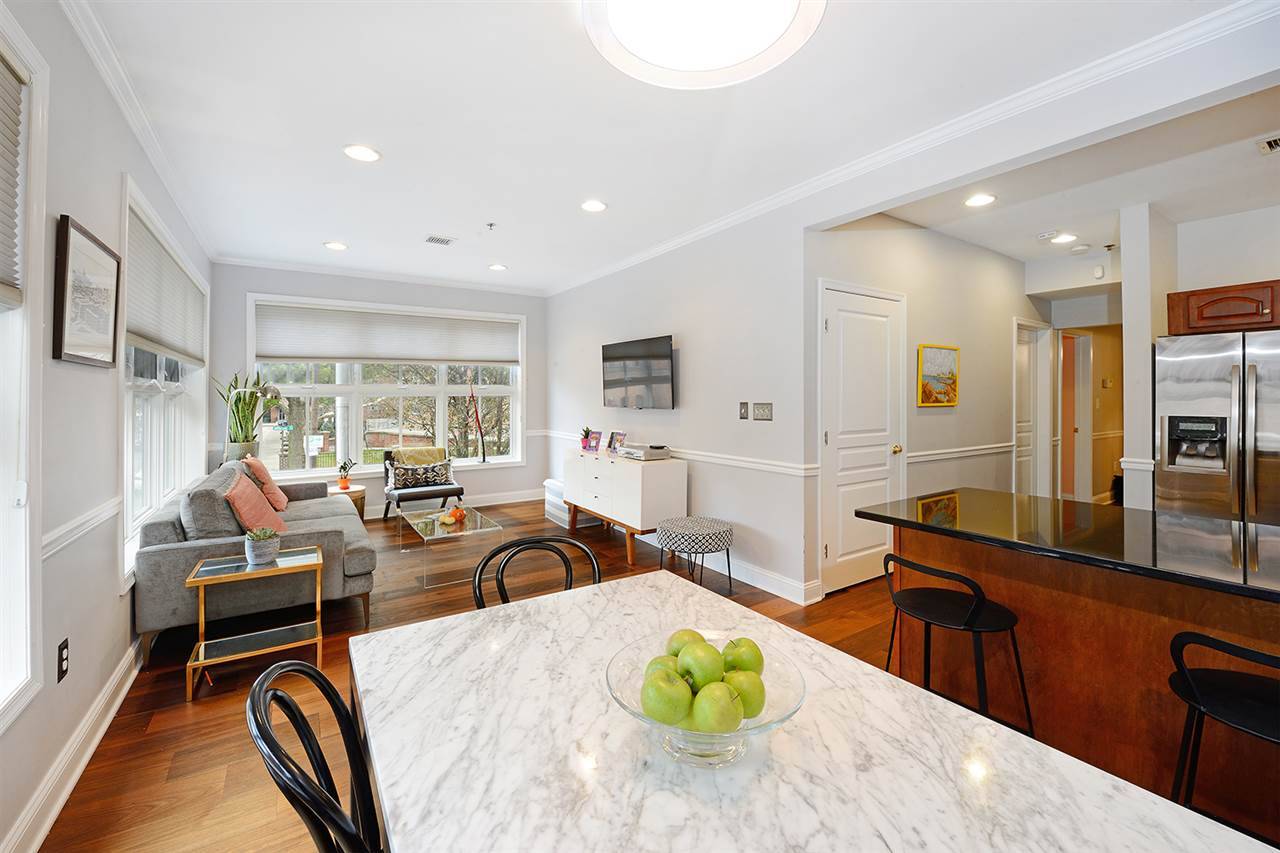Fresh & modern corner condo in Prospect Hill featuring 3 bedrooms