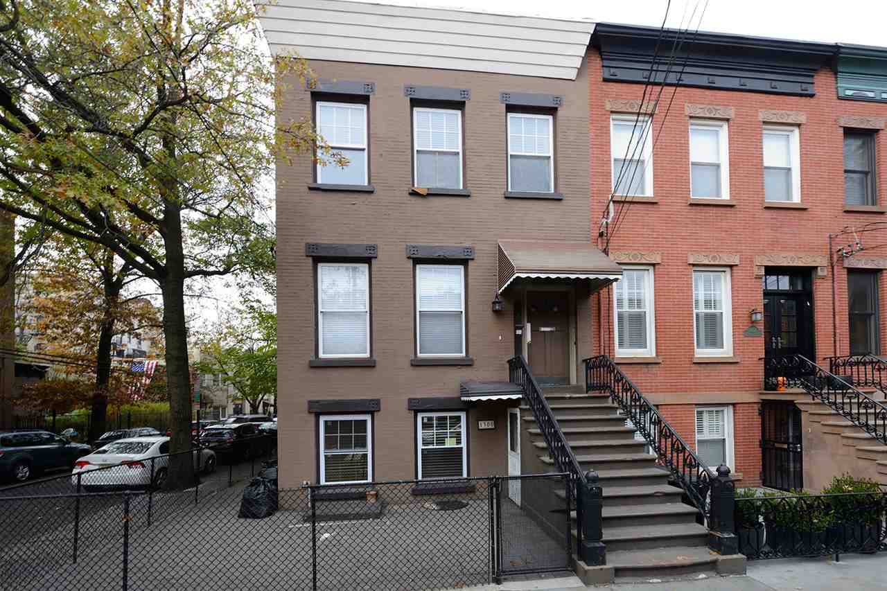 Move right into this beautiful corner brick row house with streaming sunlight from three sides