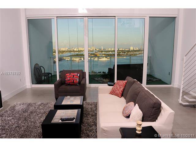 Panoramic water views are yours to enjoy in this enchanting 2-Story Loft