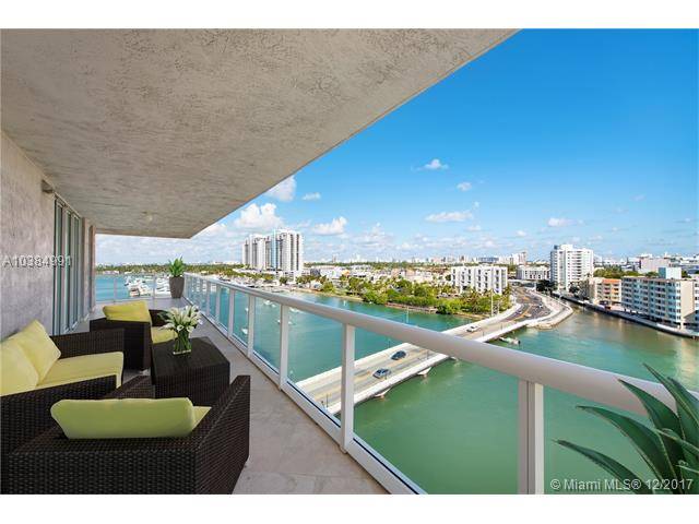 Stunning views of South Beach & Biscayne Bay greet you from the best NE corner residence in the building