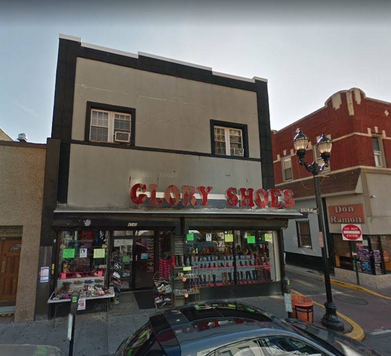 2 story brick mixed use property containing 6 residential units and 1 commercial space