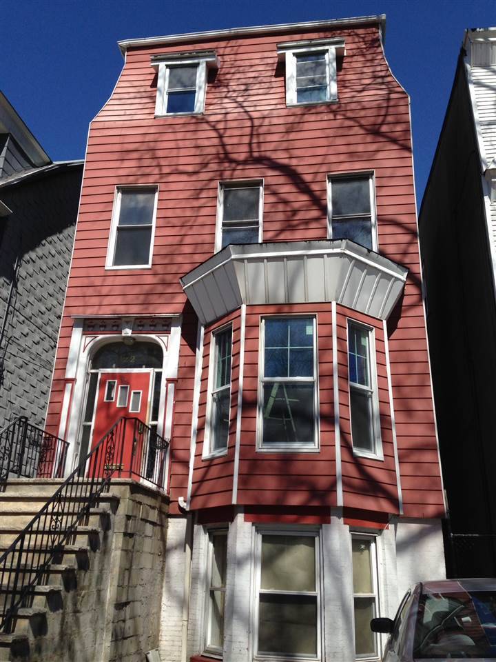Sunny one bedroom on the top floor of a two family brick semi attached rowhouse
