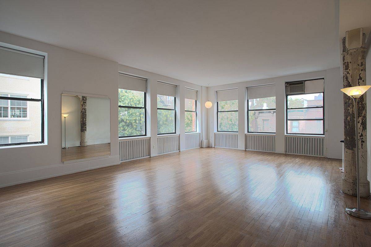 Exceptional NoHo 1 Bedroom Corner Live/Work Loft Apartment with 1.5 Baths featuring a Large Studio Space