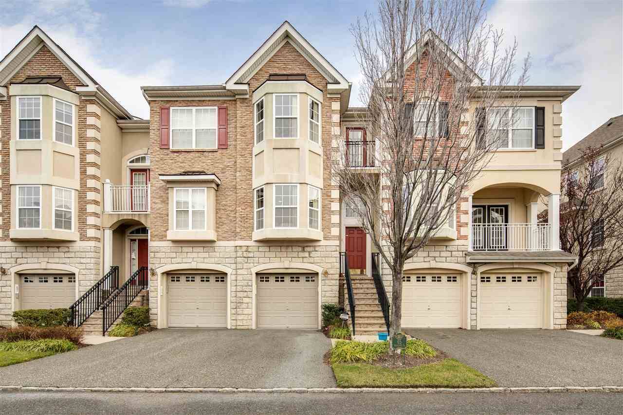 Welcome to this Impeccably maintained townhome in this private waterfront gated community