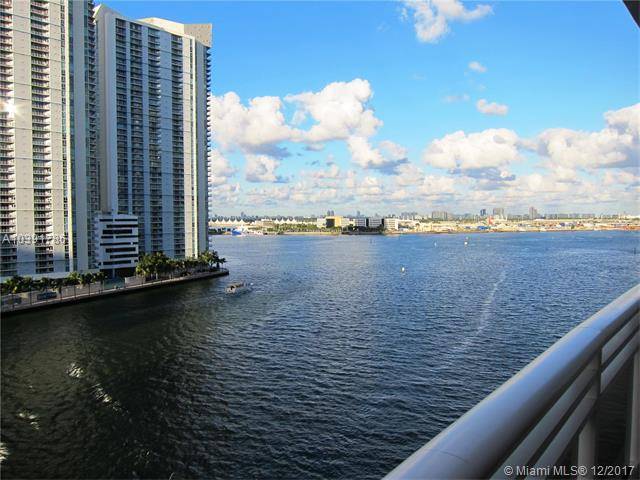 Marvelous views of Biscayne Bay & Miami River from this exquisite spacious luxurious residence on beautiful Brickell Key