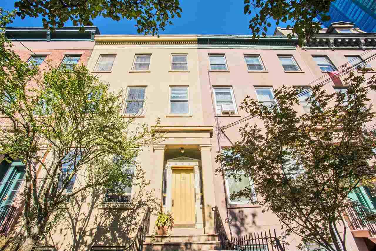 This South facing 22 foot wide Paulus Hook Brownstone sits on one of Downtown Jersey City's top blocks