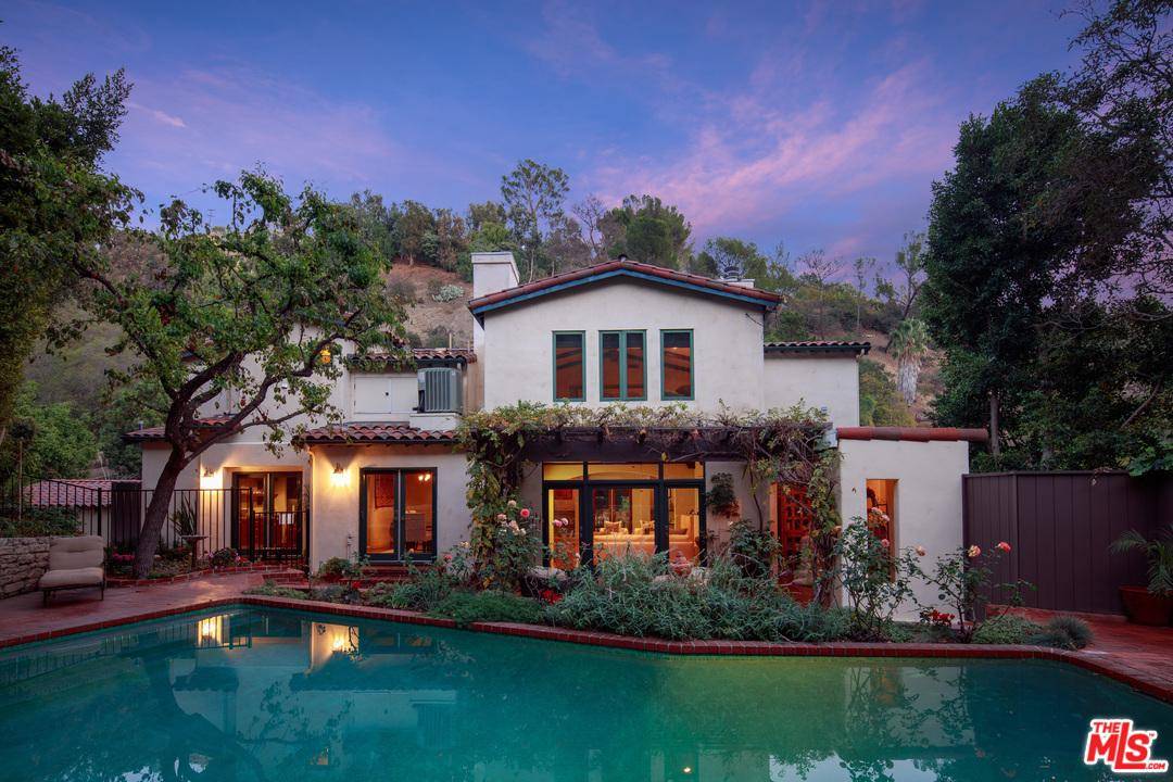 This stunning Montecito-style Spanish compound is a rare opportunity to own an elegant home sited on over 1/2 acre of bucolic