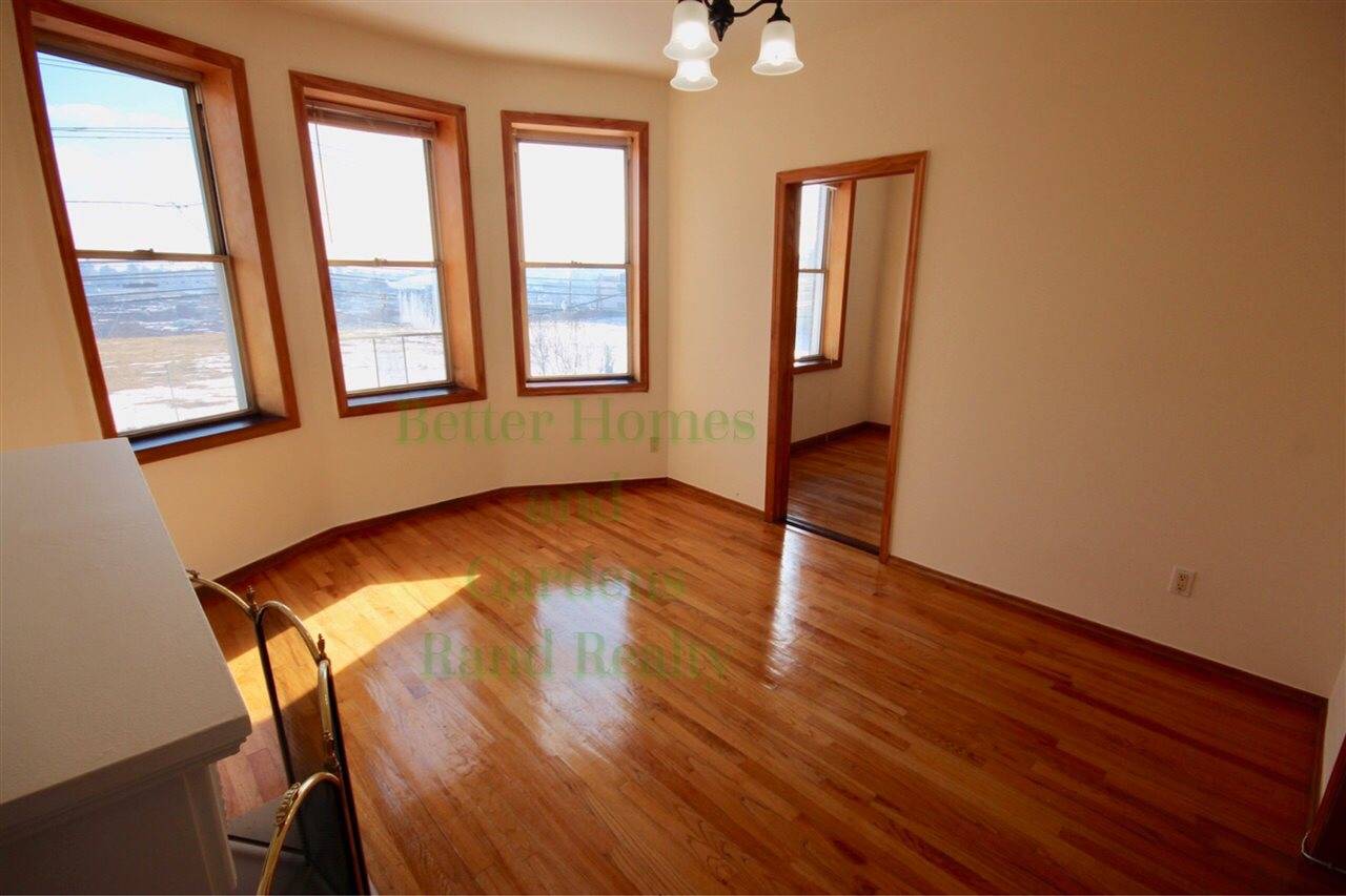 Welcome to your updated 1200 square foot sun-filled 3 BR with a full NYC skyline view