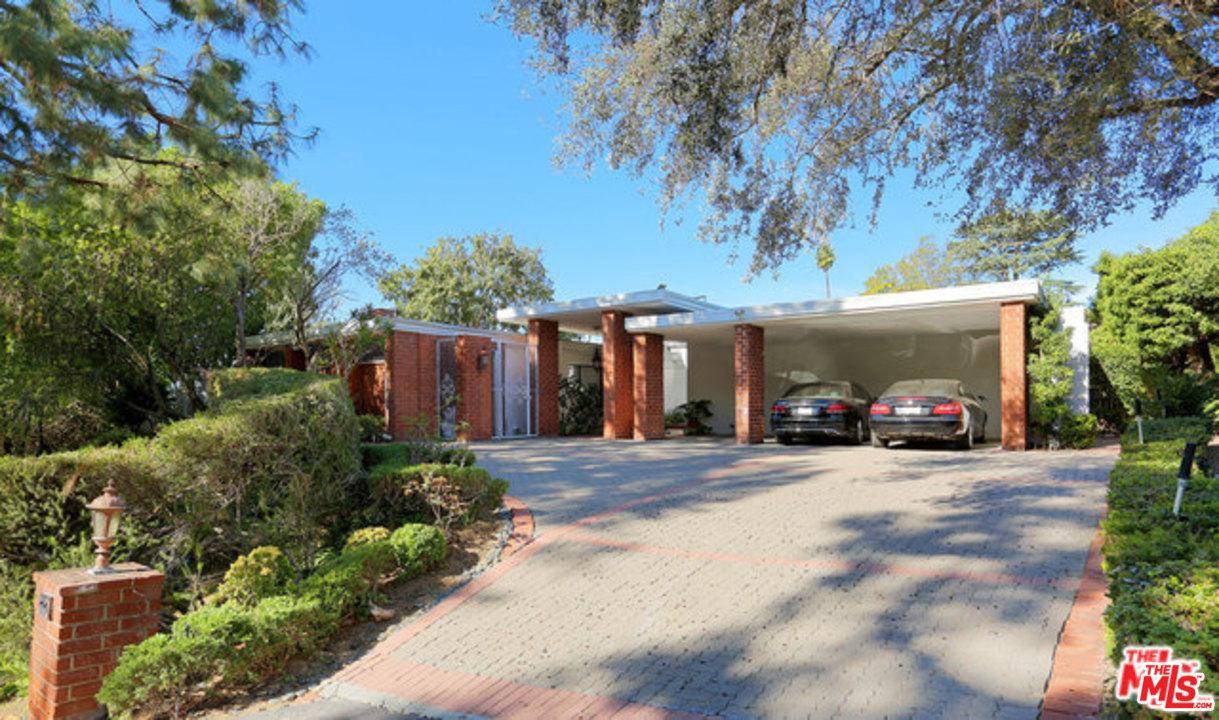 Ideally located in prestigious Beverly Hills Trousdale Estates