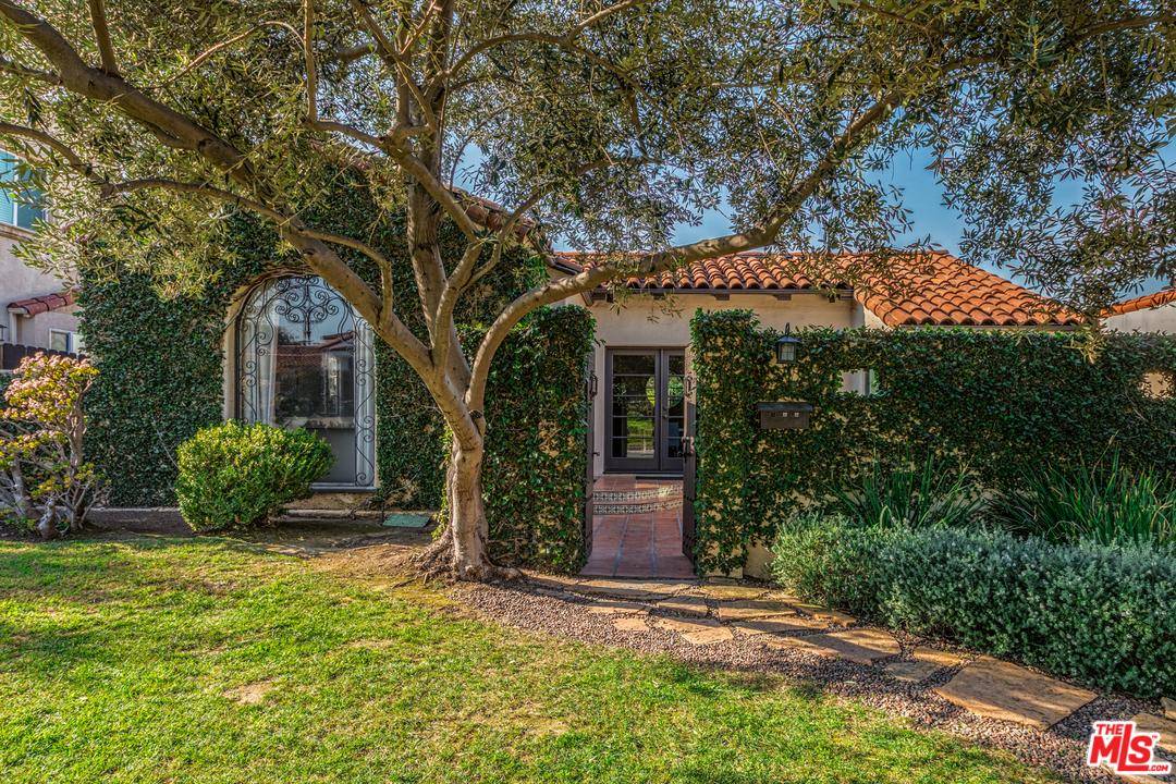 Enter this updated 1924 built Spanish home through a private