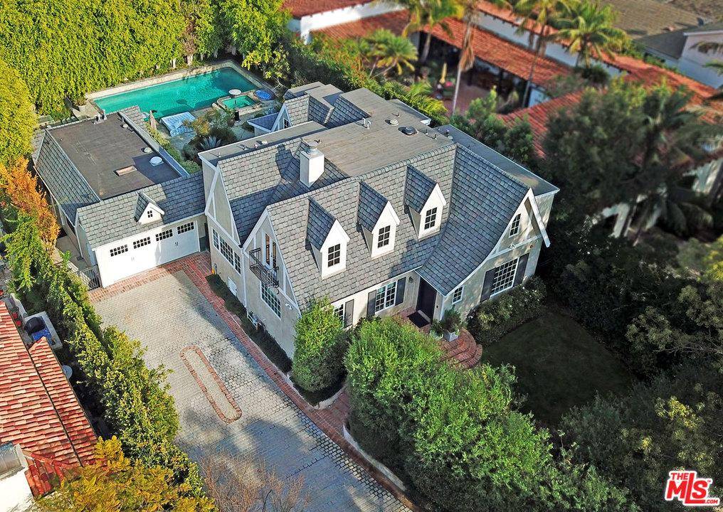 Welcome to this extraordinary gem set upon an oversized lot in the highly coveted 