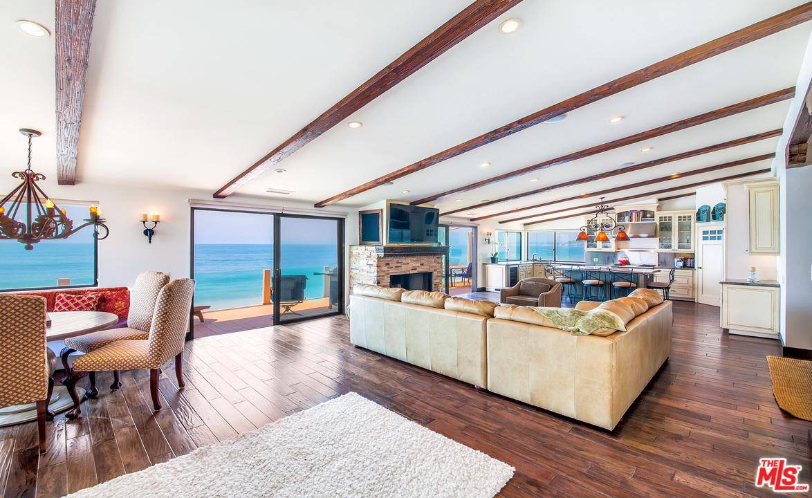 Incredible opportunity to own this rare beachfront triplex on 50 feet of prime Malibu Road