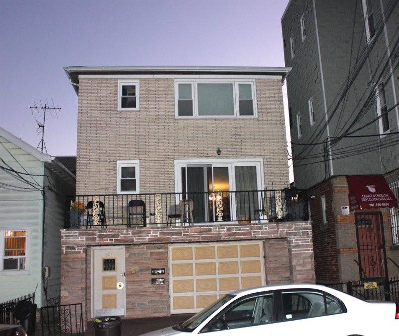 Introducing this solid brick two family house with a bonus apartment and one-car garage parking on 25 x 100 ft lot in the heart of Jersey City Heights