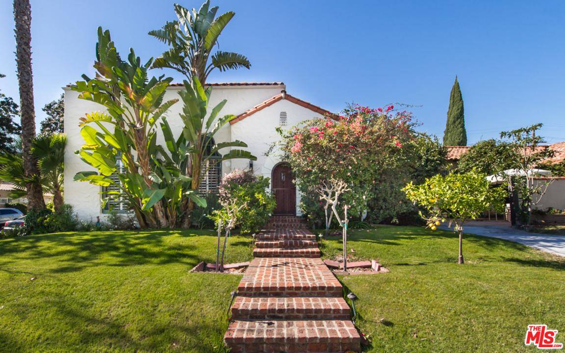 Rarely does a property this special become available: an architectural gem on a corner lot of one of the most desirable streets south of Wilshire