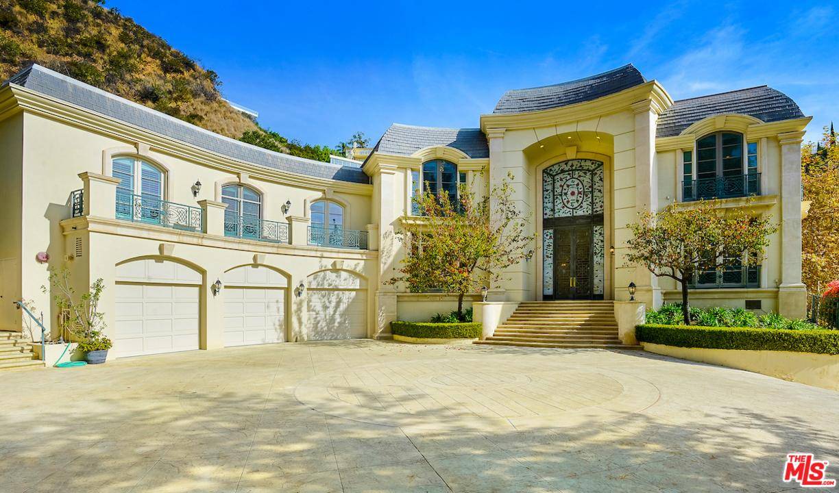 Sequestered at the end of a small cul de sac in prime Bel-Air just above the Bel-Air Hotel sits this gated Mediterranean estate