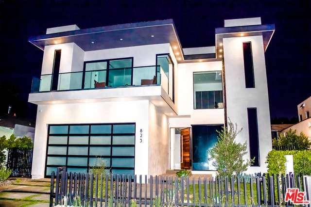 Exquisite new modern masterpiece in a highly desirable pocket of Hollywood features 5 bedrooms