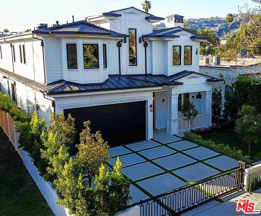East Coast traditional meets refined SoCal living in this brand new masterpiece