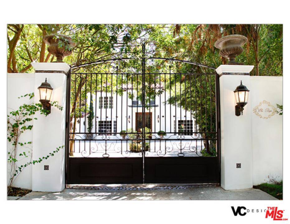 Private elegant gated estate with parklike grounds and tennis court