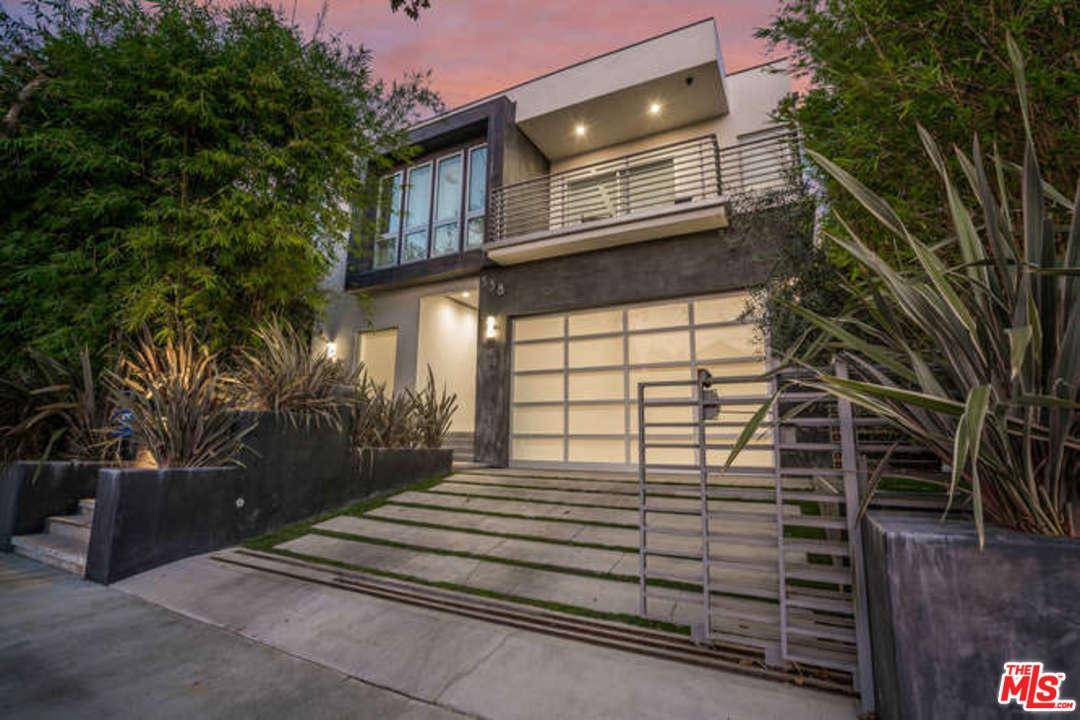 Experience luxury at its finest w/this exceptional contemporary home