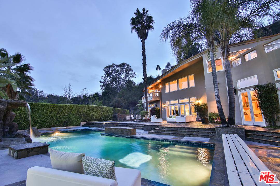 Experience your own private resort within this incredible Contemporary Villa is desirable lower Bel Air with canyon views