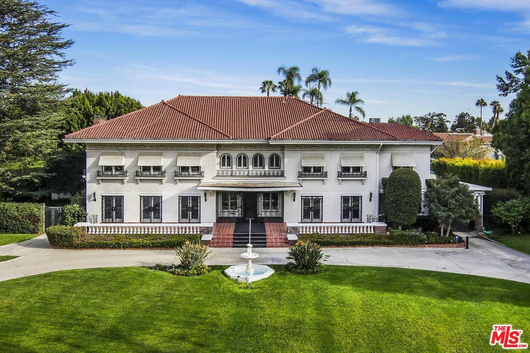 Incredible Mediterranean Revival on one of the premiere lots in guard-gated Fremont Place