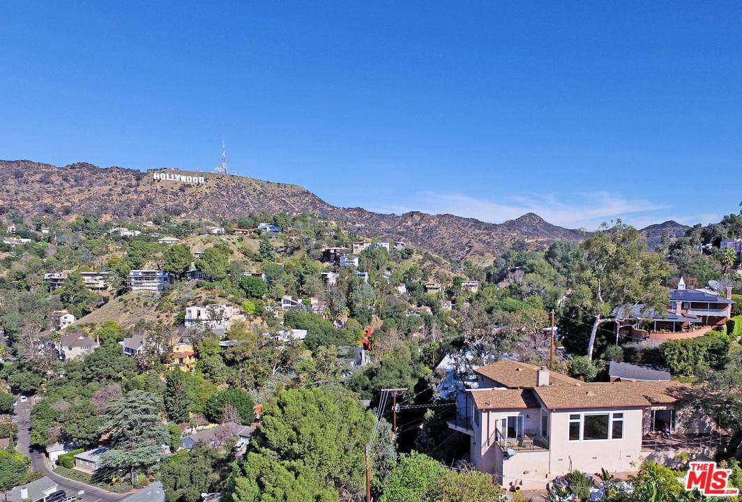 Panoramic views over the city and to the Hollywood sign from virtually every room give this bright