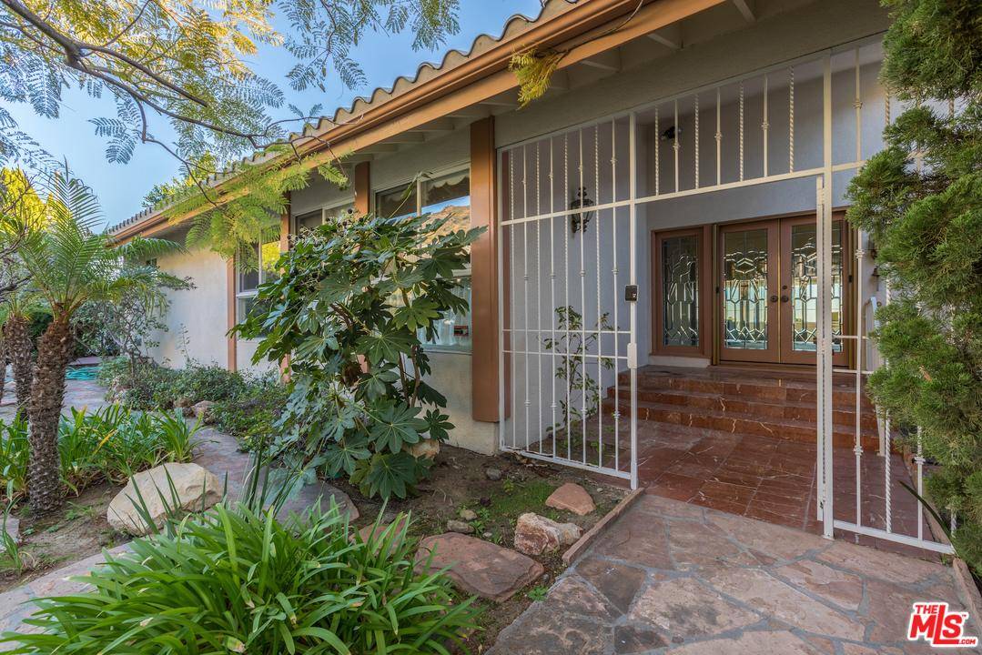 Step through the gated front entrance into the warmth of this 2612 sf