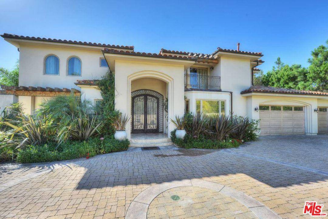 This beautiful gated Mediterranean home with private road entry off PCH offers 4 bedrooms