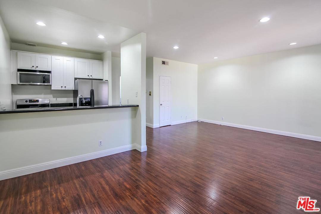 Beautifully remodeled east facing TOP FLOOR two bed two bath unit with brand new Washer/Dryer In-Unit