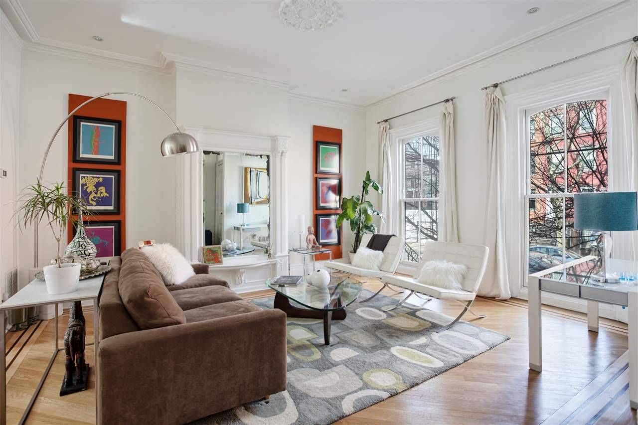 Step into this spectacular single family home on one of the most beautiful tree-lined streets in Downtown Jersey City