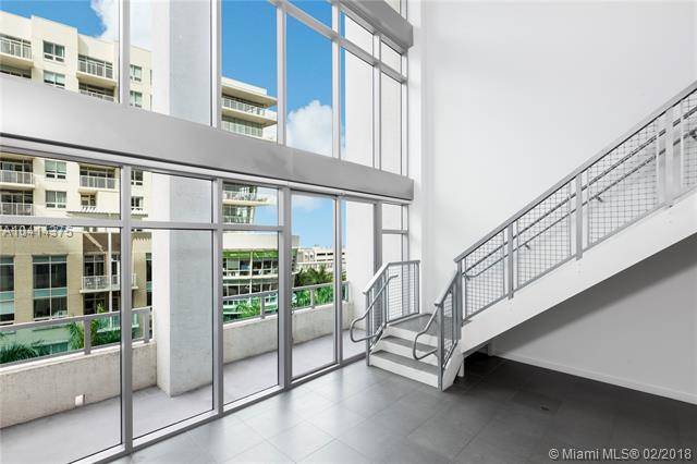 Rare Opportunity to Live in a Beautiful 2 Story Loft with Soaring 30 ft Ceilings and Lots of Natural Light