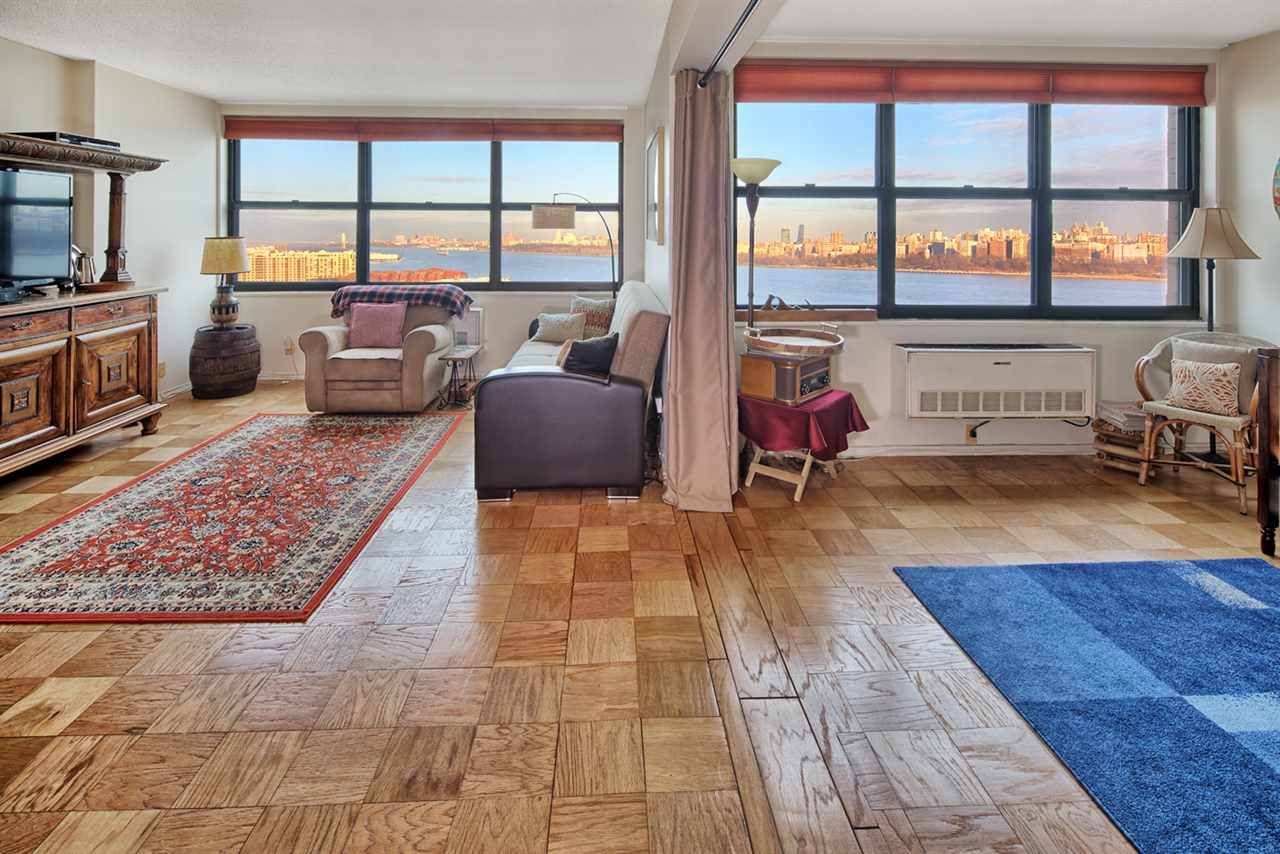 Fabulous Forever Views of New York City & Hudson River abound a wall of East Facing windows in this Sprawling 2 Bedroom/Convertible 3