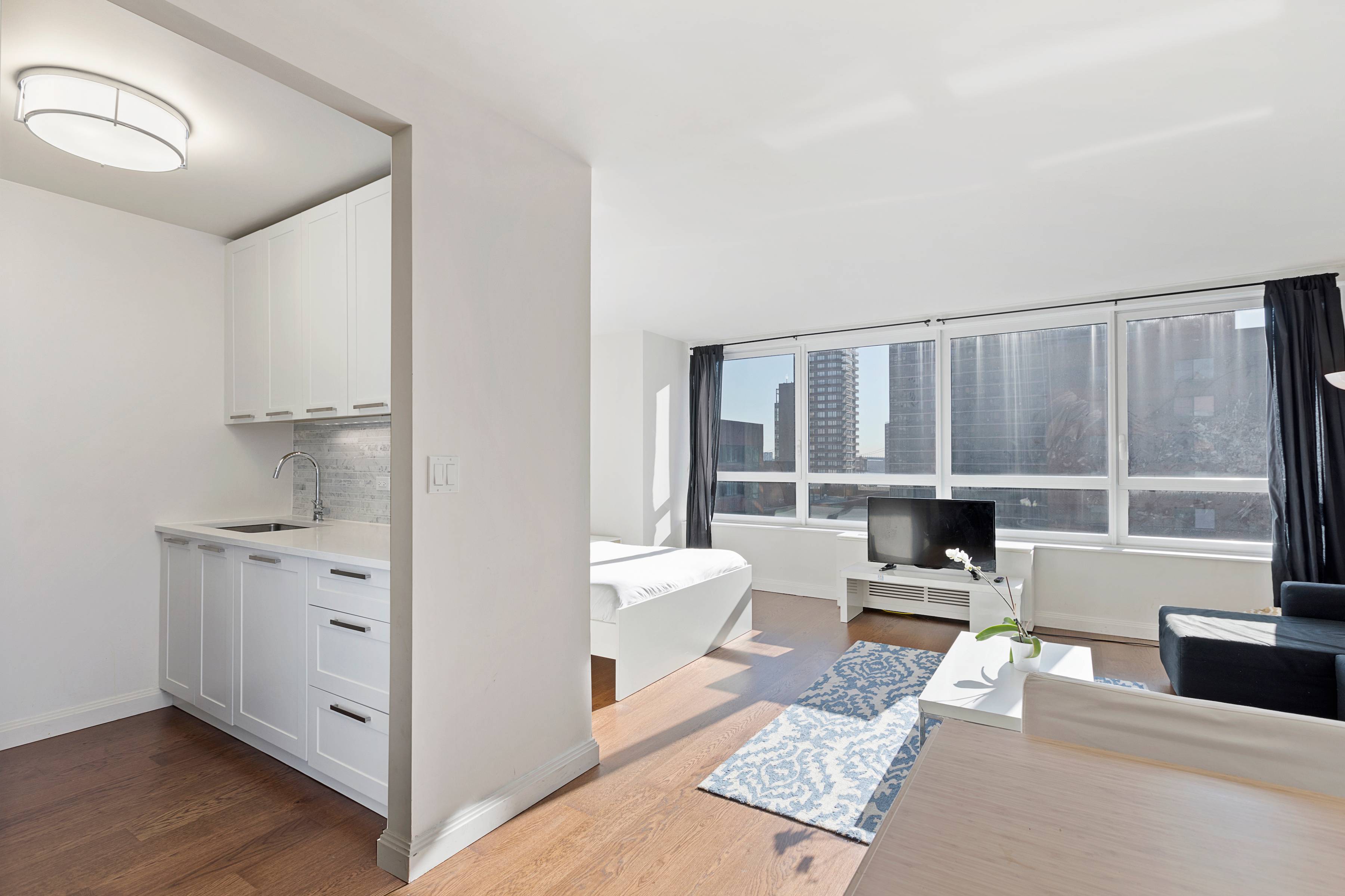 Gorgeous and Bright Studio at Carnegie Park Full-Service Condo With 24-hour Doorman, Pool, Gym and Roof Deck!