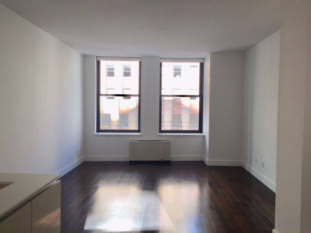 Bright 1 Bedroom, with in-unit W/D.  Heart of FiDi Doorman Building -- 1 Month Free - NO FEE