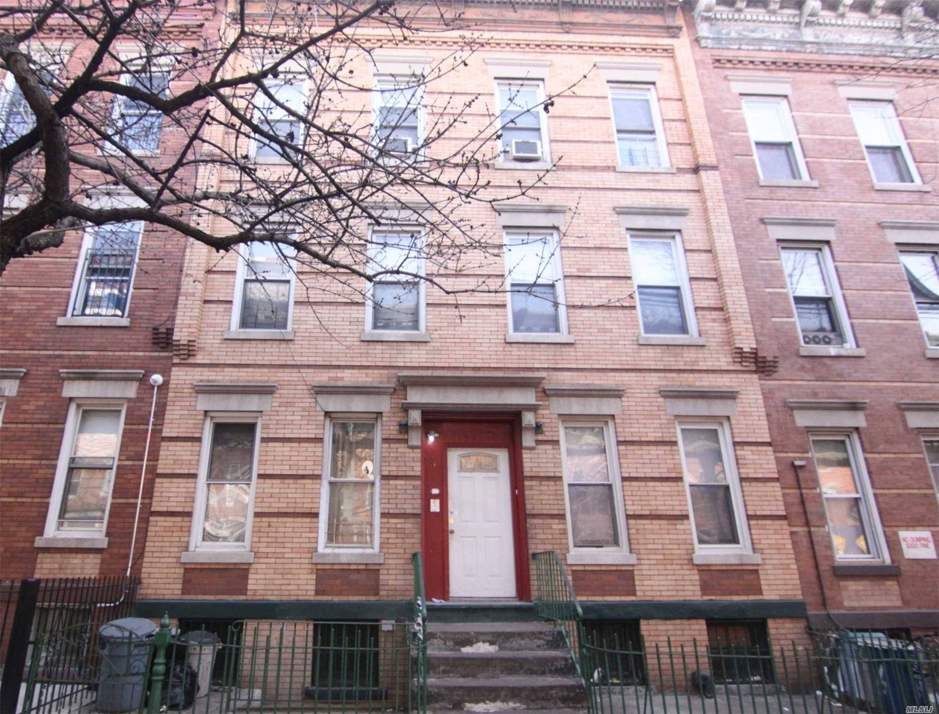 Six Family Townhouse With Two Renovated Apartments And One Vacant Apartment, A Lot Of Potential.