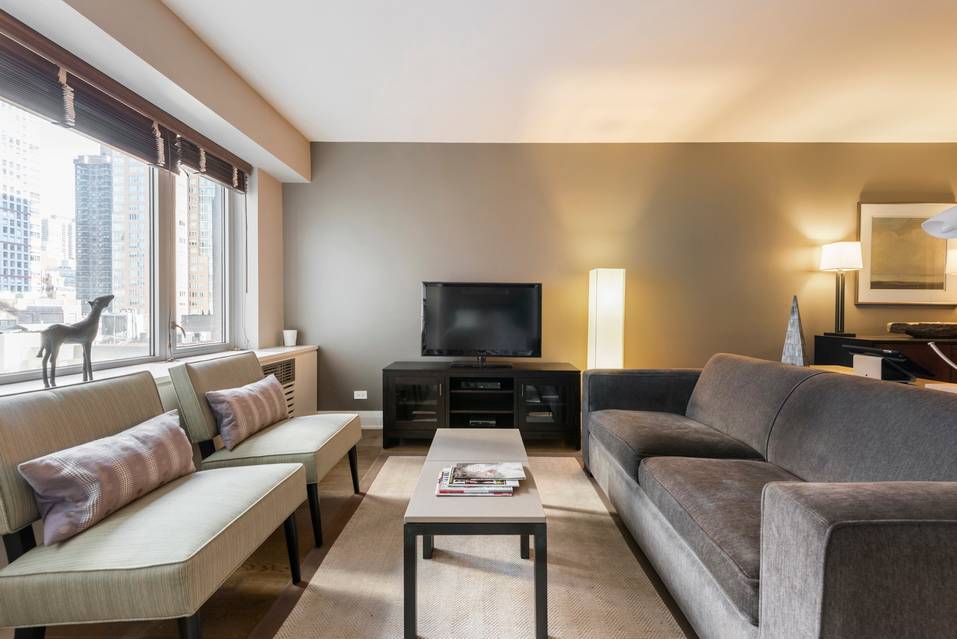 Furnished 1 Bedroom in great Midtown East location! W/D, DM & Gym.
