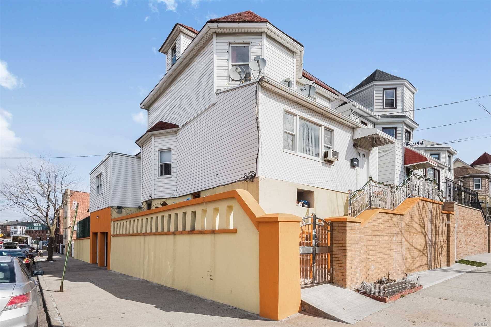 Stylish Multi-Unit Home With An Attached Two-Car Garage Sits On The Corner Of A Quiet Street.