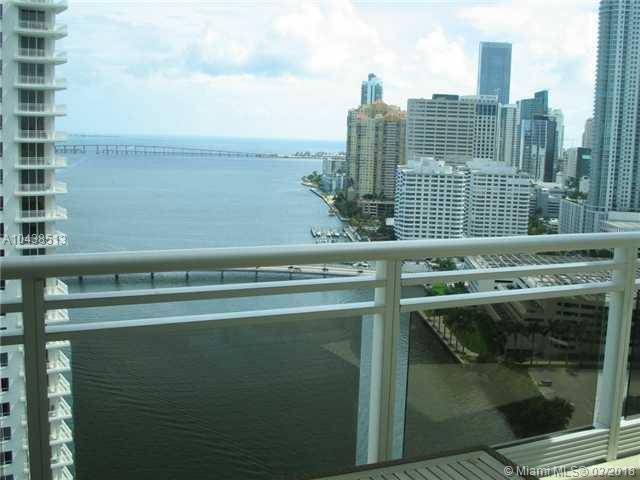 Spectacular views of the bay and city from this spacious 26th floor apartment at the exclusive Carbonell