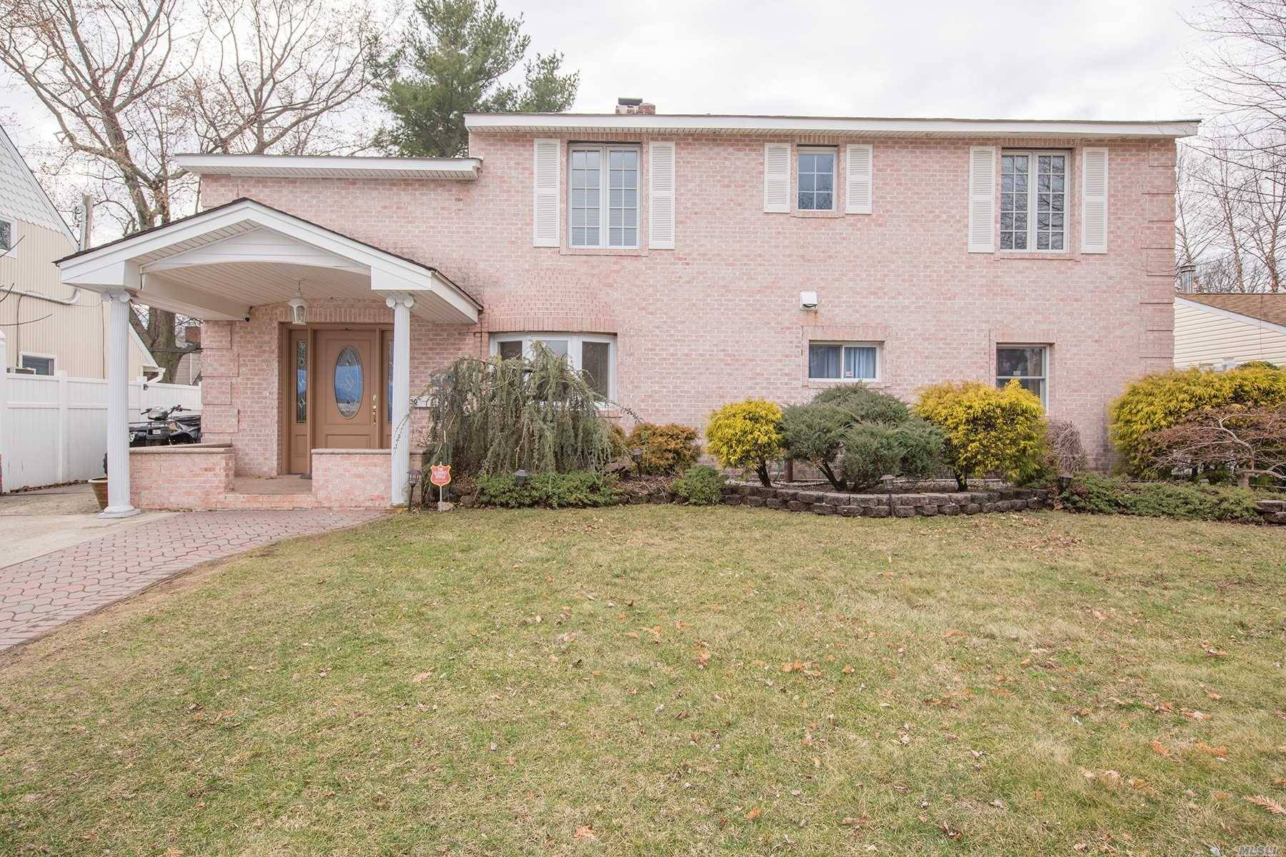 Immaculate Brick Colonial Featuring 5/7 Bedrooms, 2 Living Rooms, 2 Baths In Prime Location.