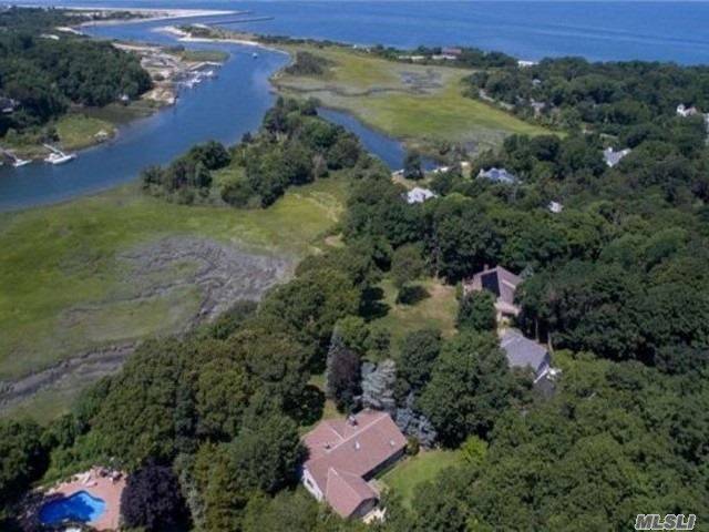 Beautiful Raised Ranch Situated On A Shy Acre With Expansive Decking Overlooking Mattituck Inlet.