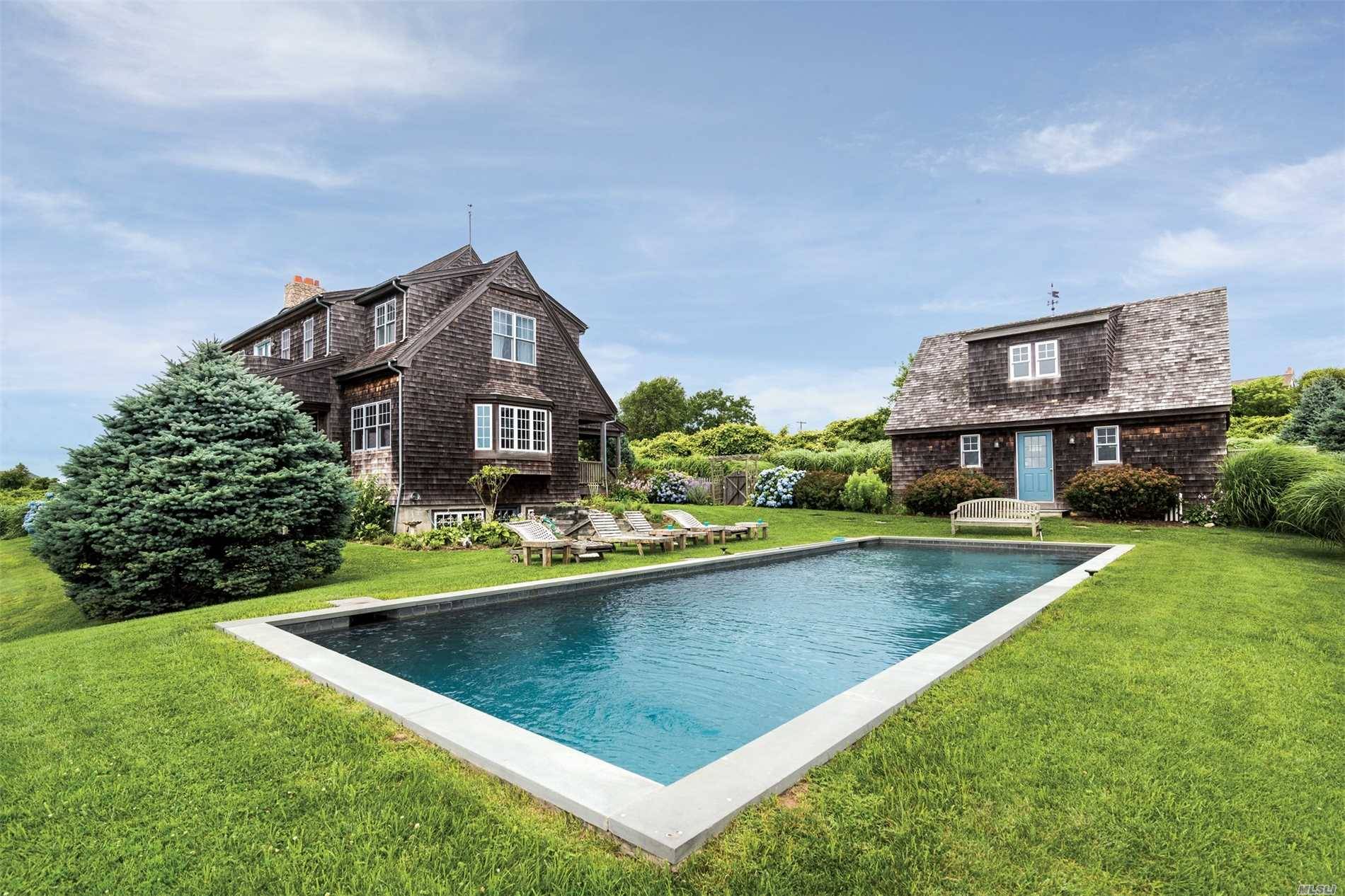Stunning 4 Br, 4 Ba West-Facing East Lake Estate With Beautiful Sunsets Over Lake Montauk.