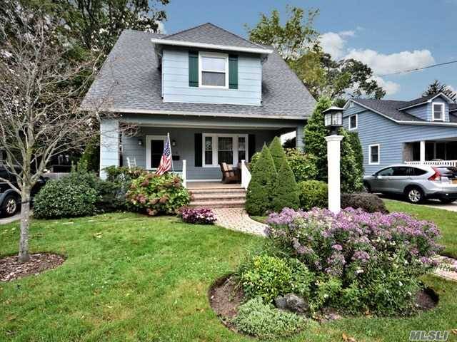 Beautiful Charming Front Porch Colonial On Over Sized Private Manicured Property.