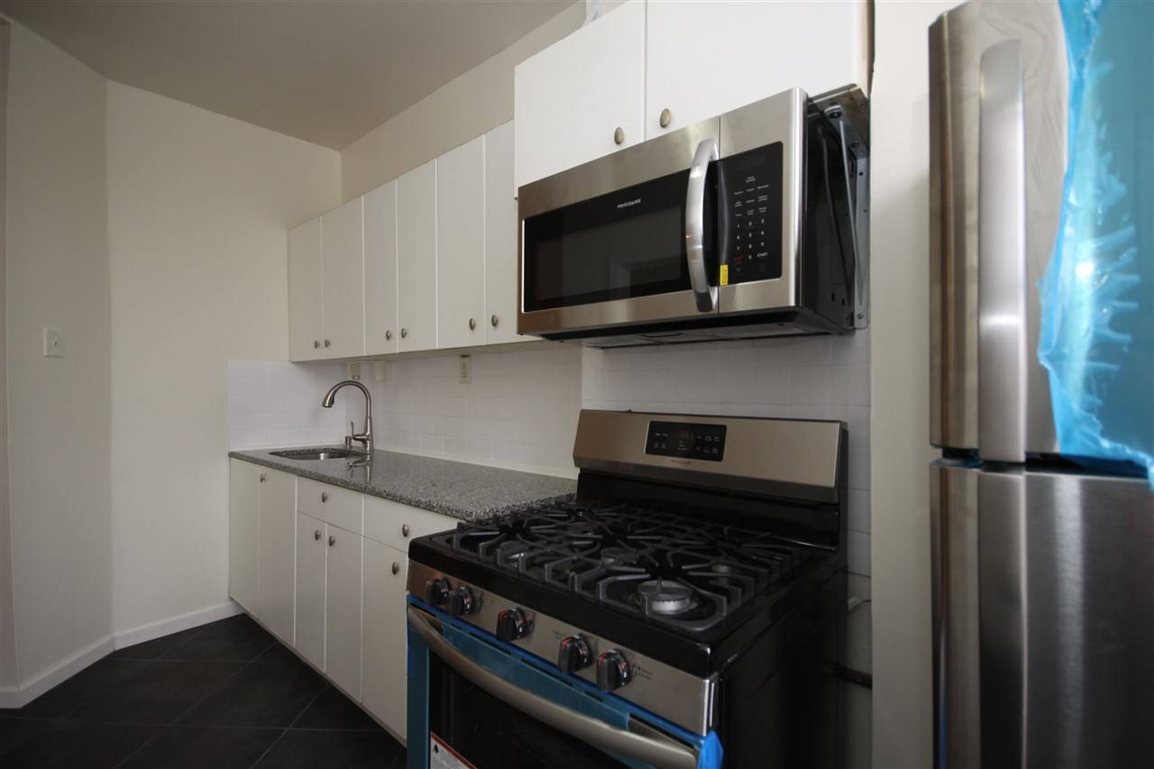 Beautiful renovated 3 bed 1 bath near the new West campus of NJCU AND 2 BLOCKS FROM LIGHT RAIL with Brand-new kitchen with stainless steal appliances