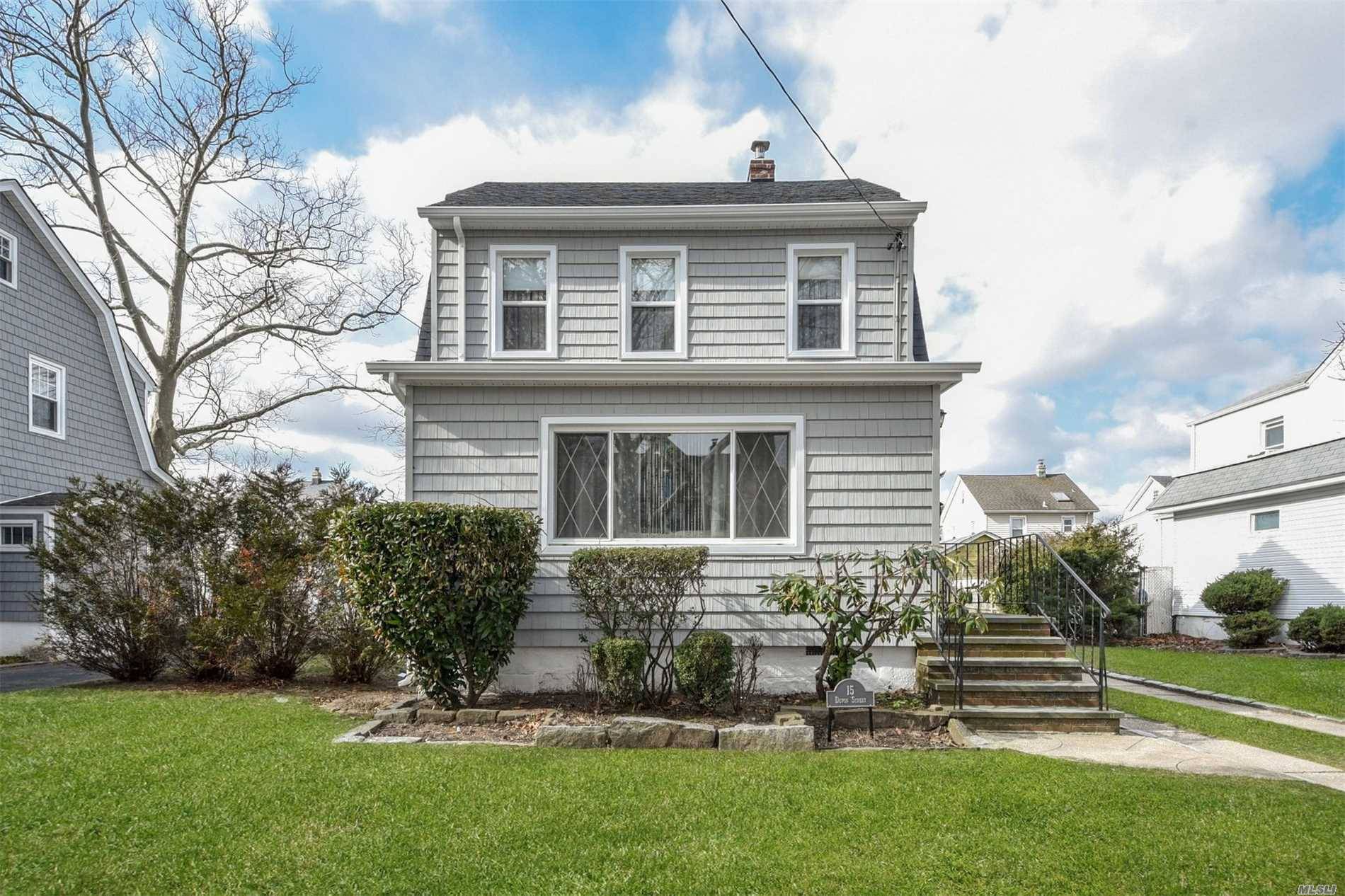 Charming, Clean & Well Maintained Dutch Colonial Located In Lynbrook On A Quiet Street.