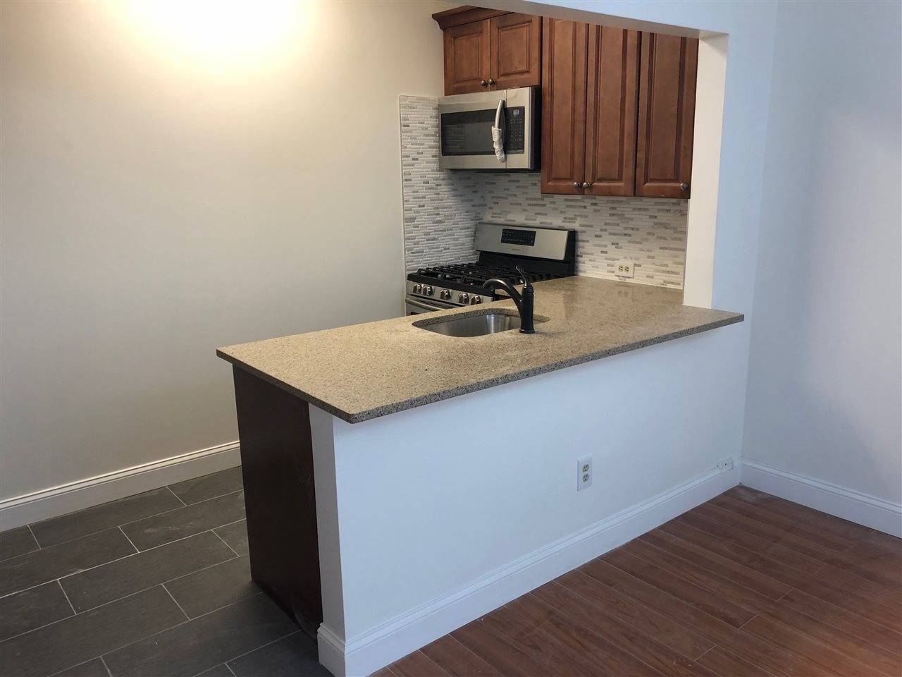 Newly renovated 1BR apartment in elevator building with parking included in amazing downtown Hoboken location